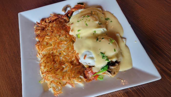 Ruby's Family Restaurant in Minnesota breakfast featuring eggs benedict and a side of hashbrowns